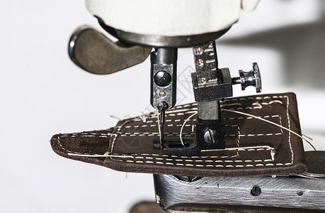 缝制皮革机器工具材料女士缝纫制作者作坊宏观腰带工作背景图片