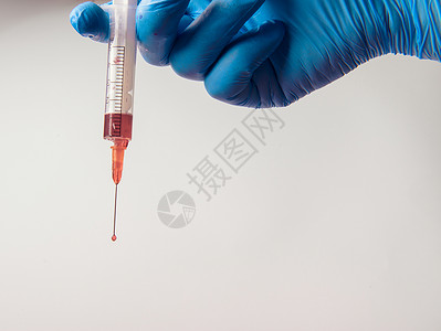 脊髓灰质炎用手套和针筒在白色背景塑料液体流感蓝色肝炎护士医院疾病注射手臂背景
