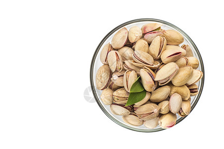 黄连木白底玻璃碗里的Pistachios小吃叶子盐渍食物团体活力种子核心坚果营养背景