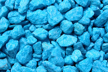 带有蓝色装饰颗粒的背景蓝宝石材料颗粒剂石头宝石背景图片