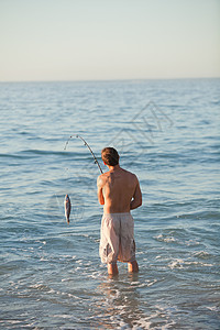 活人捕鱼男人男性海洋海岸乐趣娱乐儿子孩子爱好闲暇高清图片