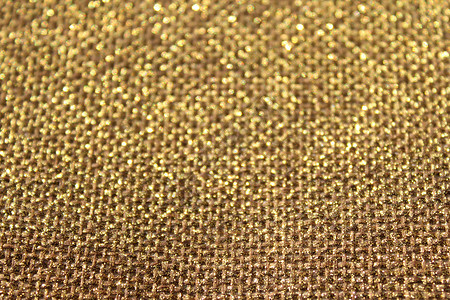 棕色闪闪发光的背景黄麻纺织品金子金色亮片背景图片