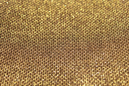 棕色闪闪发光的背景亮片金色黄麻金子纺织品背景图片