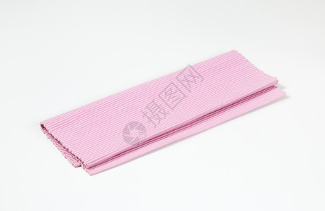 带丝的粉色地垫棉布台垫织物肋骨编织桌布折叠纺织品背景图片