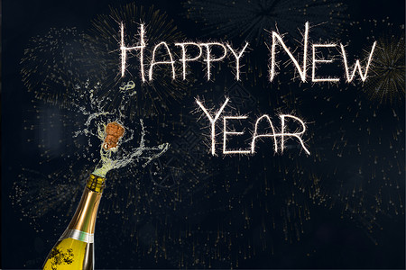 黑色背景的新年贺词和香槟新年背景图片