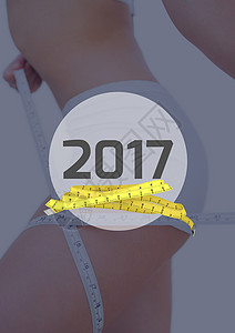 2017年与2017年相比测量大腿的妇女黄色周长躯干身体磁带卷尺节食数字重量饮食背景图片