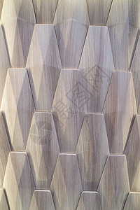 作为抽象组合物的浅灰褐色塑料碎片控制板建筑学盘子镶板装饰硬木六边形墙纸房子材料背景图片