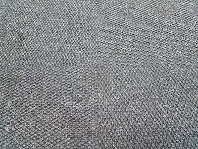 黑色或灰色地毯或地板上的地毯背景图片