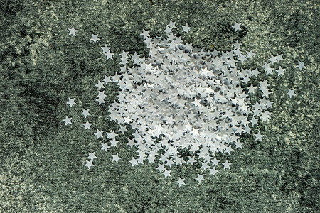 圣诞卡概念星形白色平铺石头星星框架背景图片