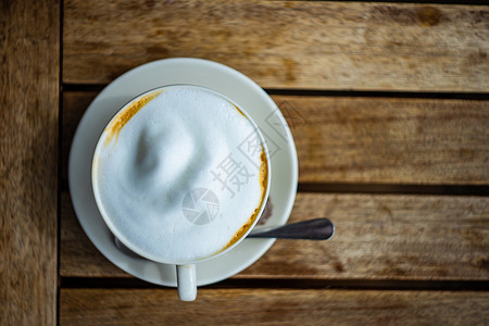 清晨杯卡布西诺银器牛奶咖啡盘子黑色杯子刀具水泥饮料卡片背景图片