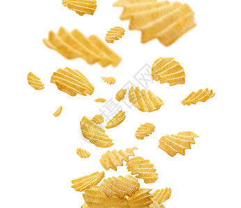 白色背景的电流马铃薯薯片悬浮黄色薯条芯片广告盐渍航班瓦楞食物圆形垃圾背景图片
