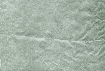 绿色空白皱巴巴和又脏又臭的美纹纸背景宏观羊皮纸墙纸艺术古董空白床单包装回收横幅背景图片