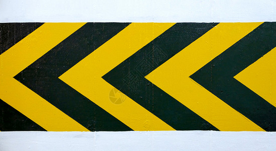 黄箭口香糖左黄黑墙警示路标背景
