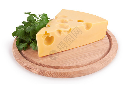 奶酪块食物木板木头小吃奶制品牛奶熟食商品产品树叶背景图片