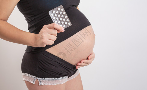 怀孕 人和医疗保健概念特写孕妇 孕妇维生素和矿物质 怀孕期间服用药物 感冒和怀孕 孕妇用药孩子母亲饮食症状营养腹部女性成人生活肚背景