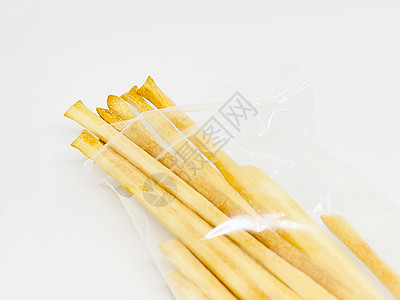 长纸条五角星一群意大利面包棒被孤立在白色背景的白纸条上营养小吃面包美食小麦桌子饮食脆皮饼干塑料背景
