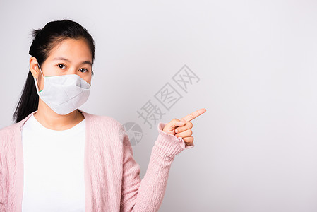 戴外科保护套的妇女面对Coro的面具卫生药品手势女孩安全工作室女性感染疾病手指织物背景图片