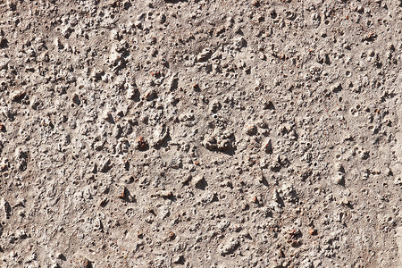 带有石块结构的水泥墙纹理街道石头砂砾质感背景图片