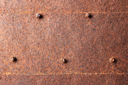 铁钉头纹质的铁制金属门腐蚀背景图片