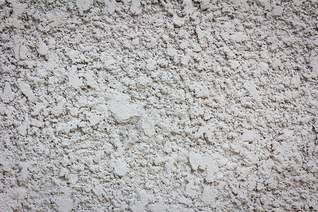 参差不齐的喷砂混凝土墙纹理背景材料裂缝地面爆破建筑石膏水泥石头乡村背景图片