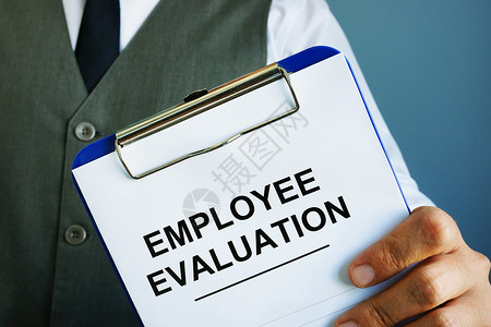 雇员考绩报告掌握在手中 (a) 雇员业绩评价报告背景图片