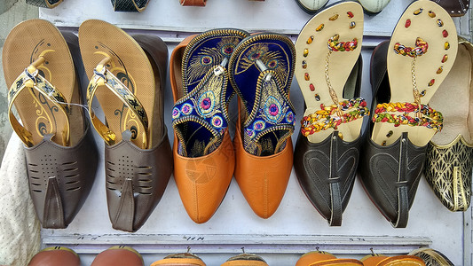 市场女士鞋舒适 失速 印度市场 凉鞋 鞋类 特写 收集 美丽 成分 商业 质地 印度市场 营销 材料 工艺 手工艺品 手工制作 传统 纪念背景