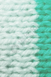 羊毛特写白色绿松石羊毛针织质地 水平沿编织钩针详细行 毛衣纺织背景 微距特写背景