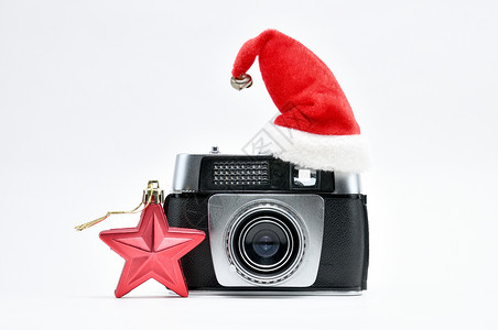 摄影师新年 古老的摄影机和新电影六角星星白色绝缘雪花绿色五尖相机格式背景图片
