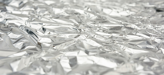磨砂皱巴巴的铝箔包装材料 f 的质地背景图片