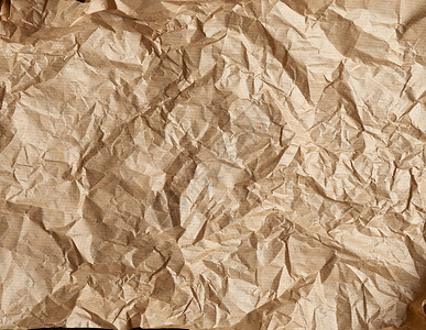 折叠的棕色羊皮纸 烤纸 全框材料包装食物古董牛皮纸工具蜂蜡床单厨房面包背景图片
