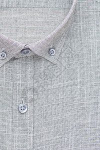 衬衫 顶视图棉布按钮衣领纺织品裁剪衣服材料服饰织物灰色背景图片