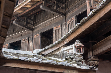 古老窗户世界遗产地Tulou社区上层楼层建筑学窗户历史遗产土楼旅行村庄房子地面文化背景