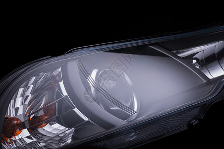 黑色背景的汽车头灯聚光灯技术运输灯泡反光板车辆玻璃机器信号塑料背景图片