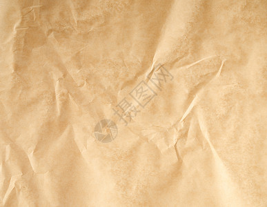 折叠的棕色羊皮纸 烤纸 全框滚动蜂蜡牛皮纸工具面包用具食物烹饪古董床单背景图片