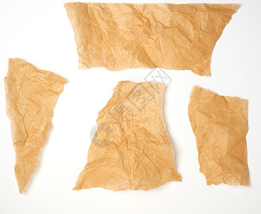 白色背景上撕破的棕色羊皮纸牛皮纸笔记边缘纸板工艺床单回收黄色材料空白背景图片