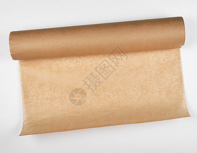 用于烘烤的棕色羊皮纸卷烹饪厨房黄色材料包装工具用具白色空白床单背景图片