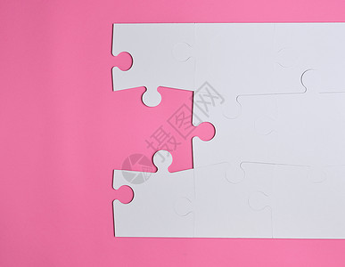 粉红色背景上的白色大空白拼图粉色创造力商业玩具解决方案游戏背景图片