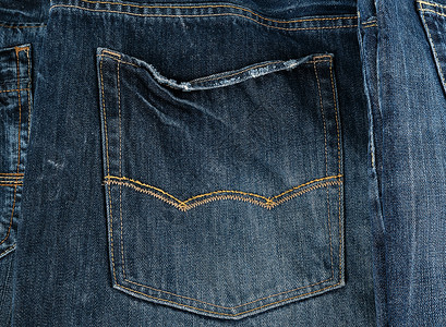 蓝牛仔裤背口袋 全框接缝工作室裤子织物纺织品牛仔布衣服材料折叠服装背景图片