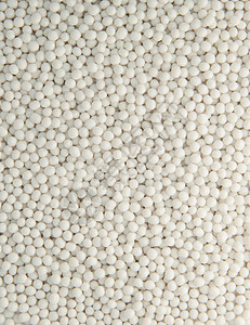 白色粒子颗粒塑料颗粒背景粮食颗粒剂颗粒状珠子材料化学品白色乙烯粒子聚合物背景