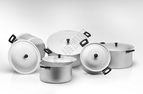 轻背景的厨房锅金属反射餐具用具铝锅阴影盘子沙锅食物烹饪背景