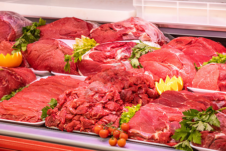 商场里肉店的肉品部营养摊位产品展示购物中心冰箱店铺橙子烹饪市场背景图片