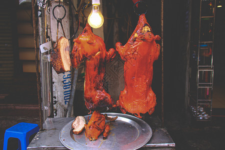 广东口味猪肉饮食摄影旅游烘烤街景美食家乳猪美食文化背景图片