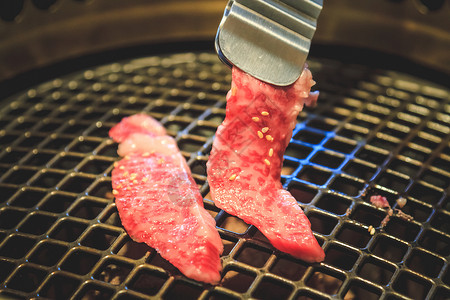 基尼西烤肉牛肉片 日本菜 雅基尼库炙烤木炭猪肉烧伤焙烧炉美食餐厅牛扒牛肉食物背景