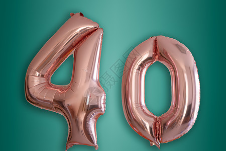 以40号形状的孤立粉红色金色Hellium气球数字空白纪念日营销流光绿色反光周年金子庆典背景图片