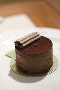 巧克力蛋糕食物餐厅小吃奶油馅饼巧克力甜点美食磨砂盘子背景图片
