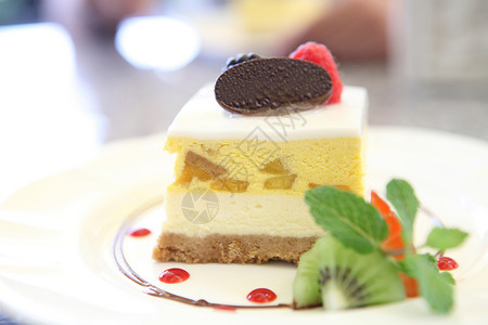 芒果穆斯蛋糕饼干巧克力黄油食物奇异果奶油诱惑浆果糖果面粉背景图片