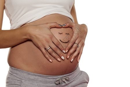 手画笑脸孕妇在肚子上装着笑容的笑脸女孩女性身体母亲父母腹部女士母性孩子婴儿背景