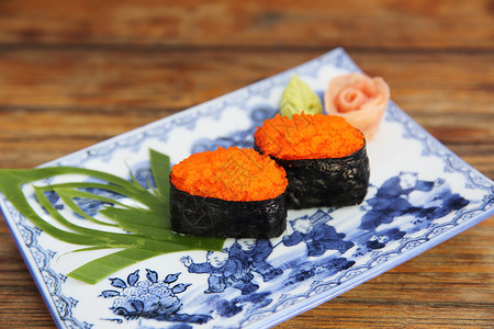 飞鱼子寿司手绘以白色背景孤立的ebiko 寿司盘子宏观午餐橙子鱼子海鲜美食小吃文化饮食背景