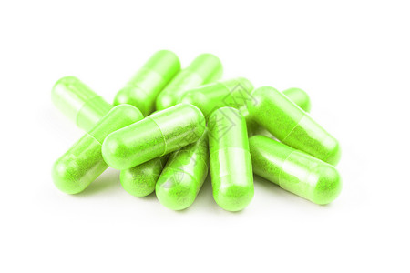 飞碟透明素材在白背景特检上以选择性焦点隔离的ufo绿色有机胶囊堆植物维生素胶囊食物药品饮食药物药店药片粉末背景