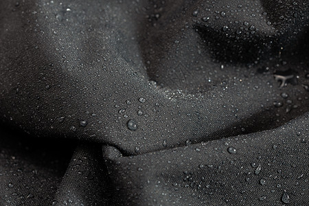 龙王布雨深灰色防水疏水布特写带雨滴选择性聚焦背景绝缘天气季节打样气泡织物材料雨衣纳米液体背景